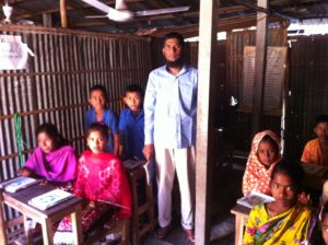 A teacher and students at Grambangla School 